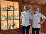 Eberhard Junghanns with his son in front of the showcase in the hotel lobby.